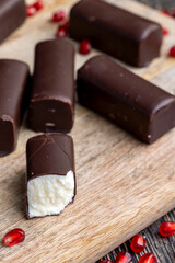 dessert of creamy filling and chocolate on a board
