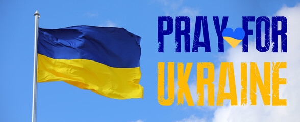 Waving national flag of Ukraine outdoors. Pray for Ukraine