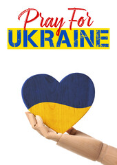 Hand of mannequin with heart painted in colors of Ukrainian flag on white background. Pray for...