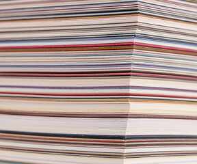 sheets of paper of various colors and thicknesses, cross section