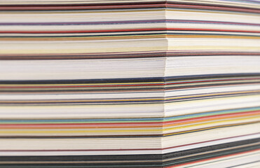 sheets of paper of various colors and thicknesses, cross section