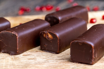 dessert of creamy filling and chocolate on a board