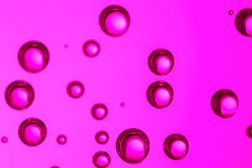 Clear water with bubbles on color background, closeup