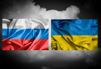 Flag of Russia and Ukraine against the dark sky