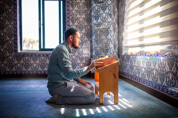 Bearded man praying in the mosque