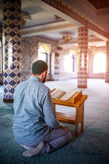 Bearded man praying in the mosque
