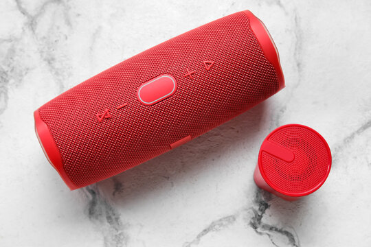 Wireless portable speakers on light background