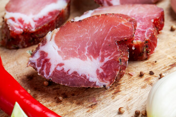 pork and bacon sliced during cooking