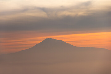 Fototapeta na wymiar Sunset view with mountain top. View of Mountain Ararat in sunset.