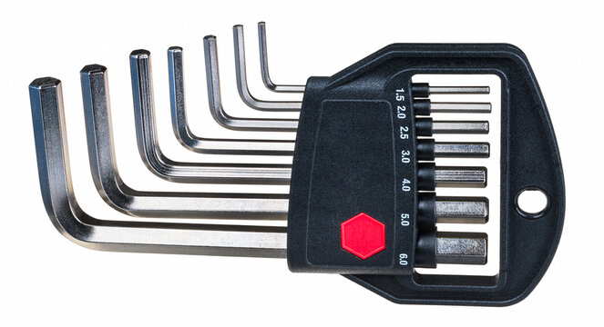 Steel hex key set of various size in plastic holder isolated on white background. Closeup of metal Allen wrench toolkit in black box with red hexagon, metric scale or hanging hole. Screwing hand tool.