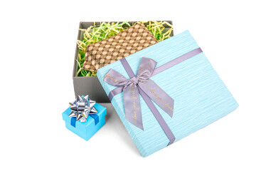 a slightly opened gift box with a bow, with a tie inside