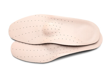 Pair of leather orthopedic insoles on white background
