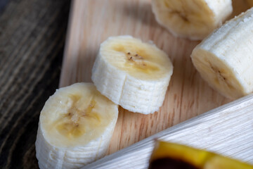 sliced banana on a wooden table while cooking