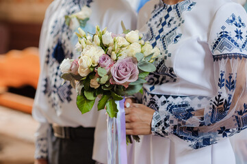 Bouquet of flowers in the hand of the bride