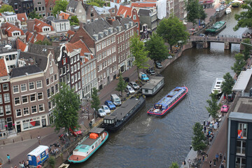 Aerial view of the cityscape with high buildings and Amsterdam canals