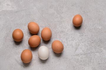 Natural chicken eggs on grey background