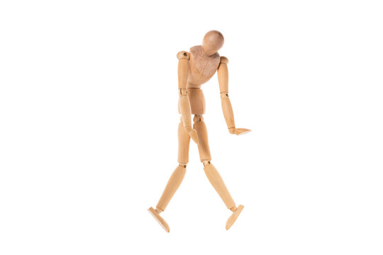 wooden man with twisted legs and arms from below isolated on white background