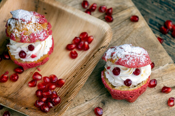 red cranberry-flavored cake with cranberry berries and creamy milk filling