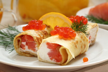 Pancakes with salmon, cream cheese and red caviar