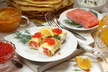 Pancakes with salmon, cream cheese and red caviar