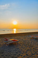 Sunbeds on the beach of Rimini in Italy	
