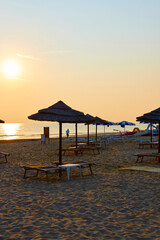 Umbrellas and sunbeds on the beach of Rimini in Italy