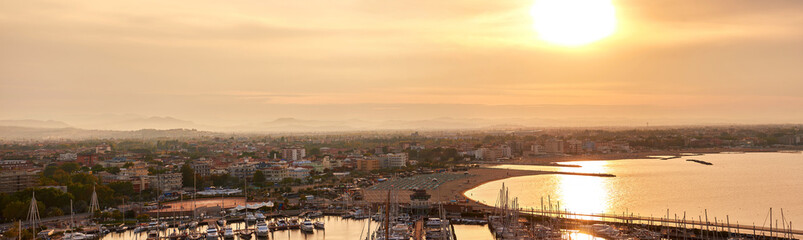 Aerial view of Rimini sea port with ships and blue water. 