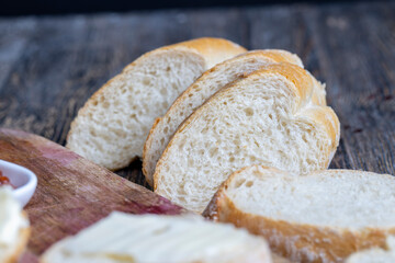 wheat baguette cut into pieces for cooking sandwiches