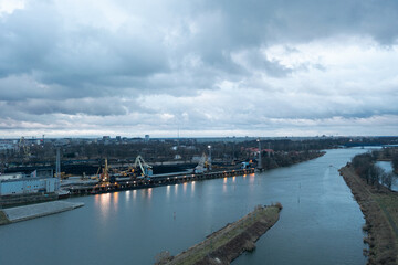 Obraz premium River and canals in the city, water channels for transporting coal on barges to the power plant