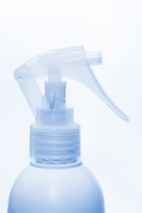 Blue spray bottle isolated on white background