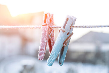 clothespin in the snow on a clothesline