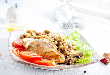 Chicken breast with fried mushrooms on plate