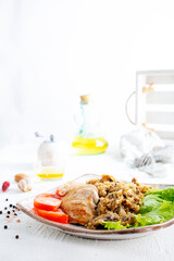 Chicken breast with fried mushrooms on plate