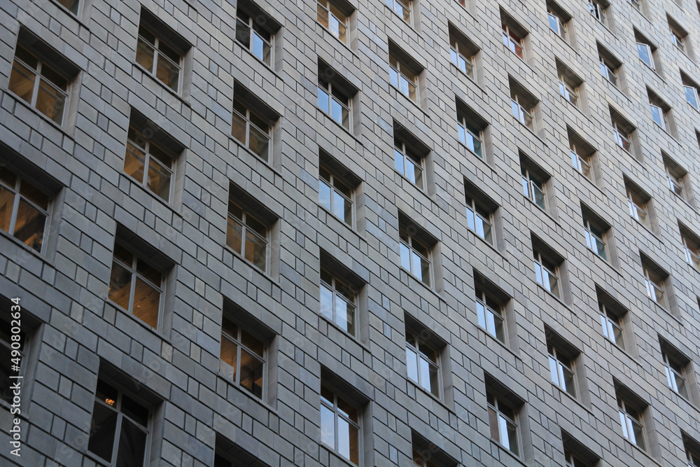 Poster view of a high building in an abstract style with many windows