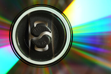 Macro shot of a compact disk with colorful glare and inscriptions 