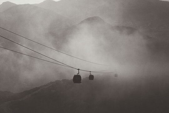 Beautiful view of a cable car in the fog