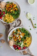 mediterranean buddha bowl with cous cous and tahini