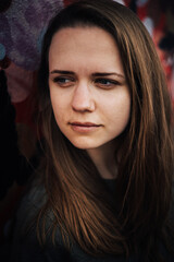 Close up shot of young woman with a beautiful face - street style photography