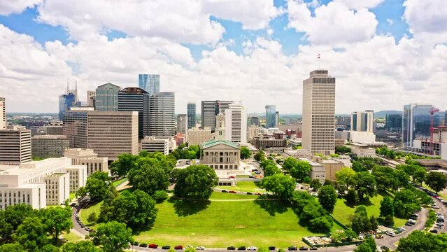 Aerial view of Nashville skyline with a slow forward camera motion towards the State Capitol. Nashville is the capital and most populous city of Tennessee, and a major center for the music industry