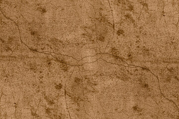 Cracked old concrete wall with brown color heavy grunge texture for background