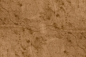 Cracked old concrete wall with brown color heavy grunge texture for background