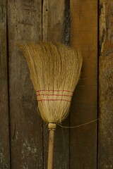 Old wicker broom on wood traditional in Guatemala
