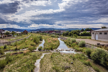 Fototapeta na wymiar View on Sucevita River in Marginea, small town famous for production of black pottery, Romania