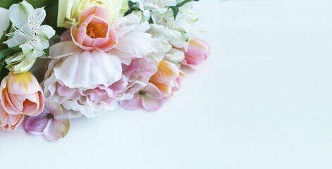 Bouquet of pink peonies and tulips on a white background. Festive flower arrangement. Greeting card background,