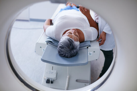 Preparing for the scan. Shot of a senior woman being comforted by a doctor before and MRI scan.