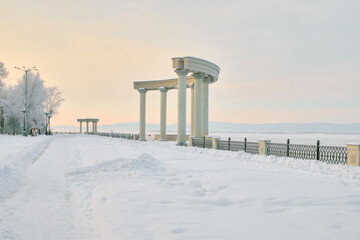 Culture and Recreation Park of Khabarovsk, Russia after heavy snowfall in the morning at sunrise. Trees in the snow.