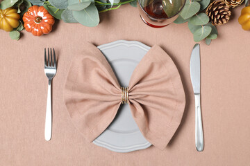 Autumn table setting with eucalyptus branches and pumpkins, flat lay