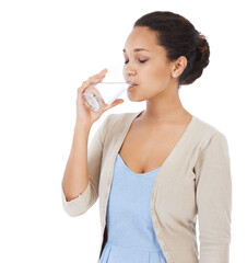 Making sure to drink enough water. Young woman drinking a glass of water - isolated on white.