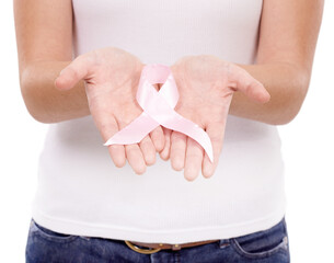 A cause worth supporting. A young woman with a breast cancer ribbon isolated on white.