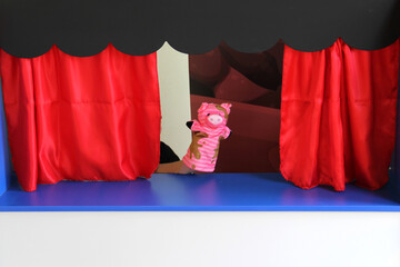 Guignol theater cultural and educational children's activity tells a story in a small replica of a...